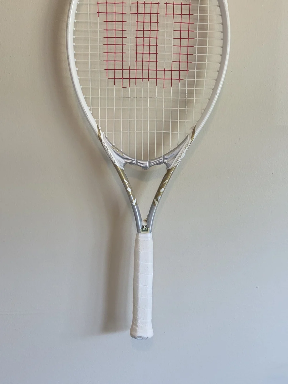 Wilson White Tennis Racket Wall Display with Red String Accent